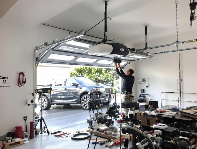 Reynoldsburg Garage Door Repair specialist installing smart garage door opener system in Reynoldsburg home